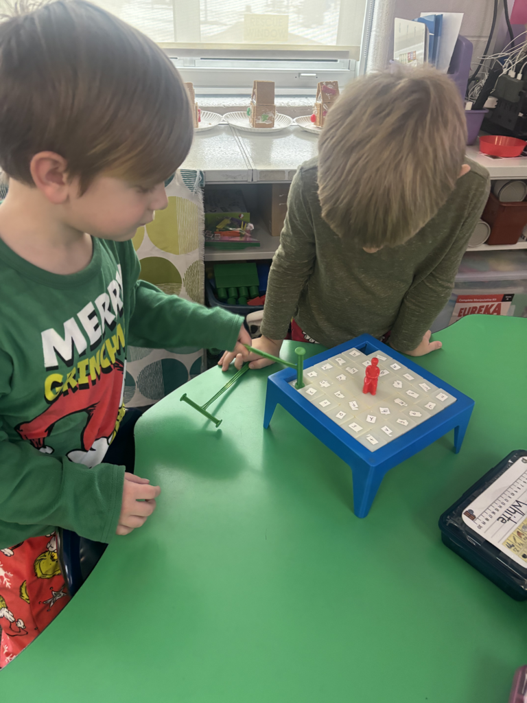 Scenes from kindergarteners’ letter games activities earlier this week. 
