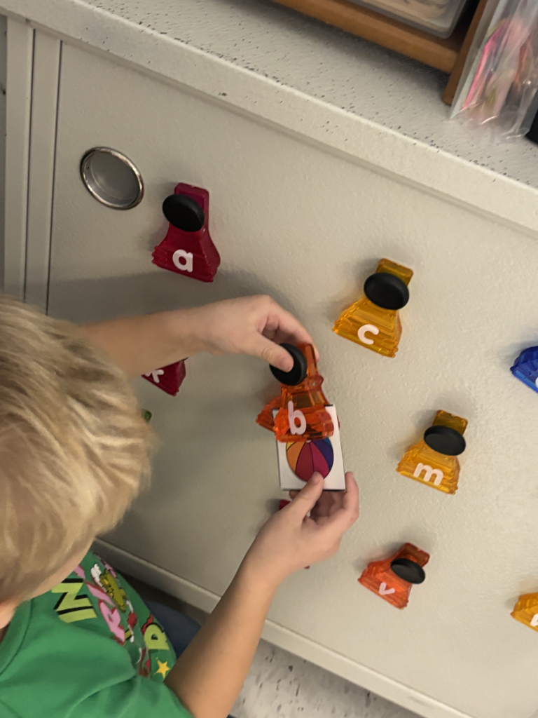 Scenes from kindergarteners’ letter games activities earlier this week. 