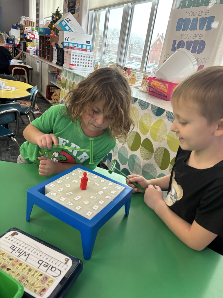 Scenes from kindergarteners’ letter games activities earlier this week. 