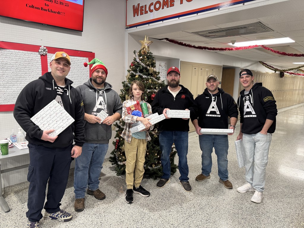 Attica Correctional Facility officers are pictured dropping off Christmas gifts at Attica Middle School Dec. 19. 