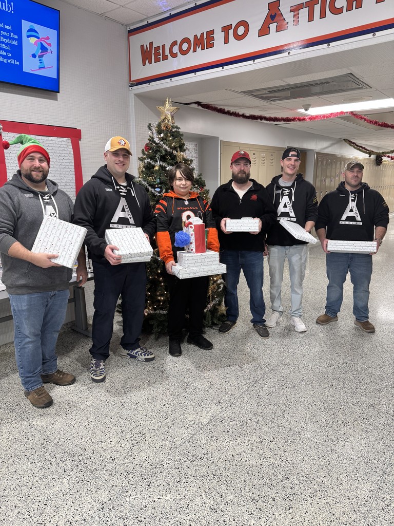 Attica Correctional Facility officers are pictured dropping off Christmas gifts at Attica Middle School Dec. 19. 