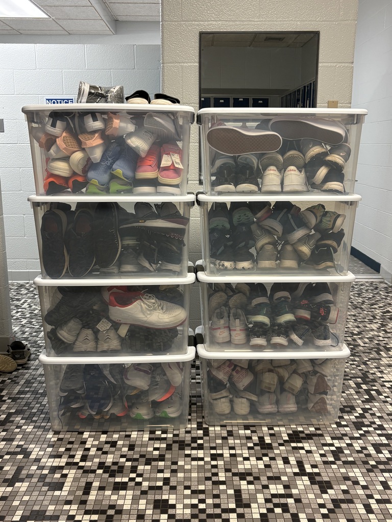 Bins of donated sneakers.