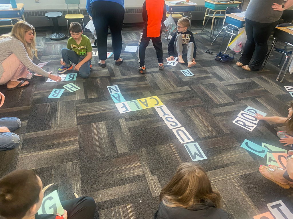 Scenes from Mrs. Lindsey Gephart’s students’ game of giant Scrabble earlier this week. 