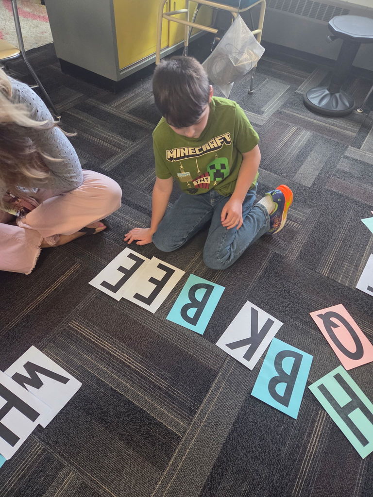Scenes from Mrs. Lindsey Gephart’s students’ game of giant Scrabble earlier this week. 