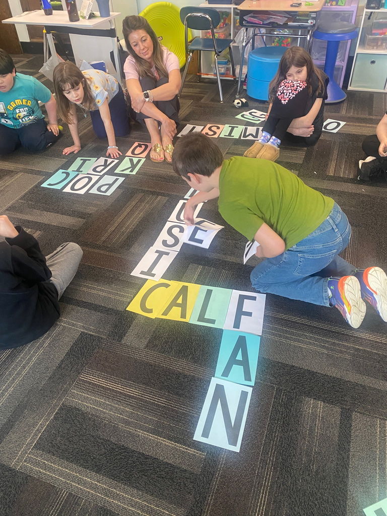 Scenes from Mrs. Lindsey Gephart’s students’ game of giant Scrabble earlier this week. 