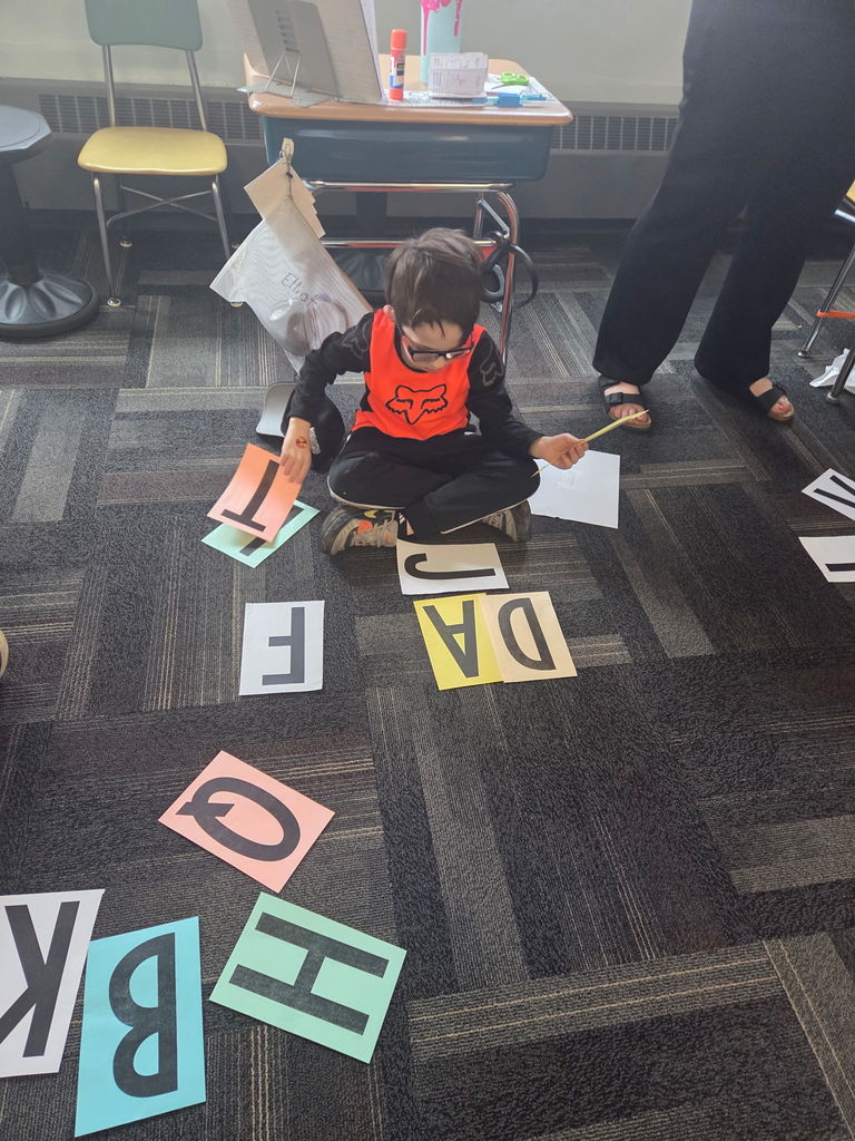 Scenes from Mrs. Lindsey Gephart’s students’ game of giant Scrabble earlier this week. 