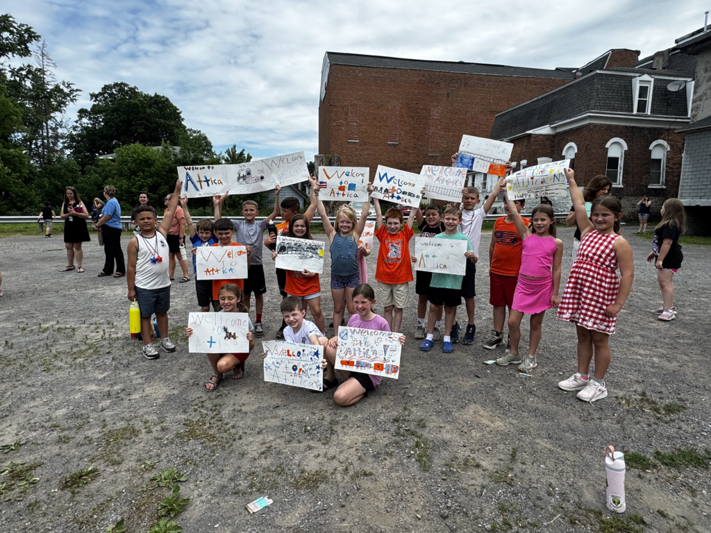 Attica Elementary School students welcome the Union Pacific ‘Big Boy’ 4014 steam locomotive on its swing through Attica Thursday morning.