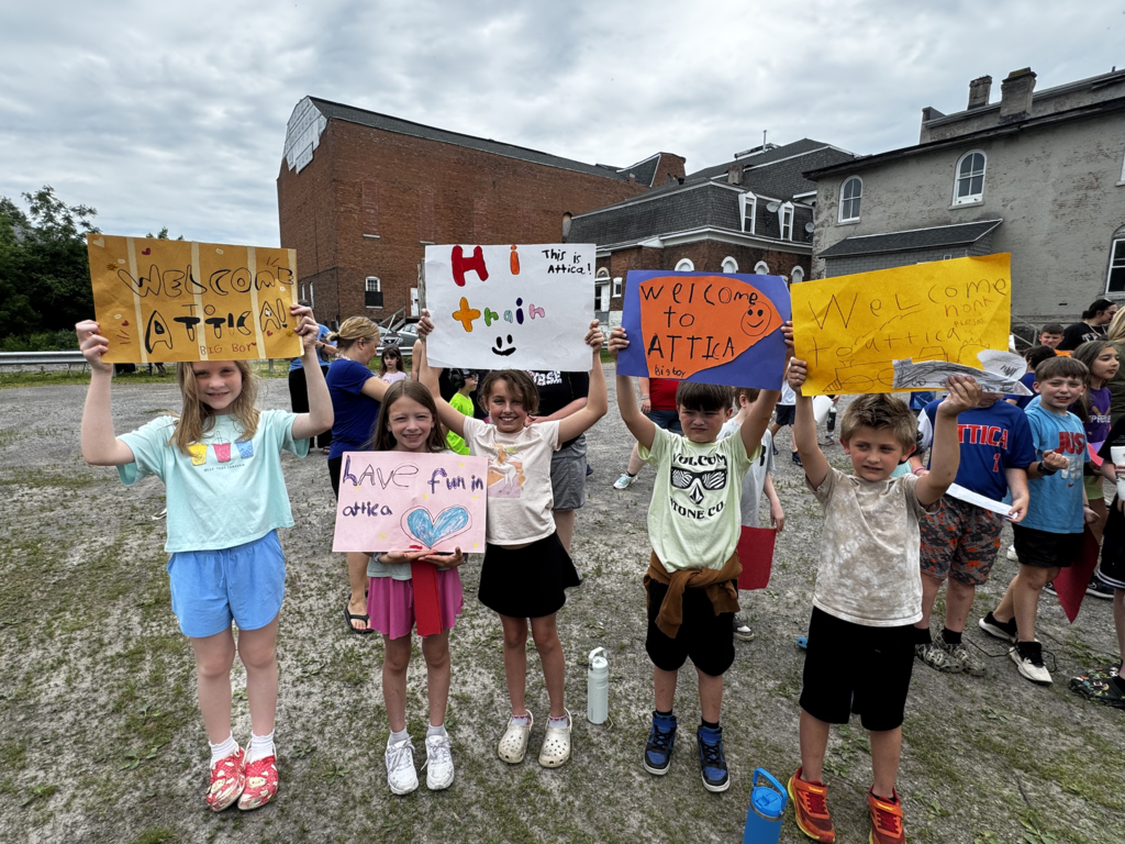 Attica Elementary School students welcome the Union Pacific ‘Big Boy’ 4014 steam locomotive on its swing through Attica Thursday morning.