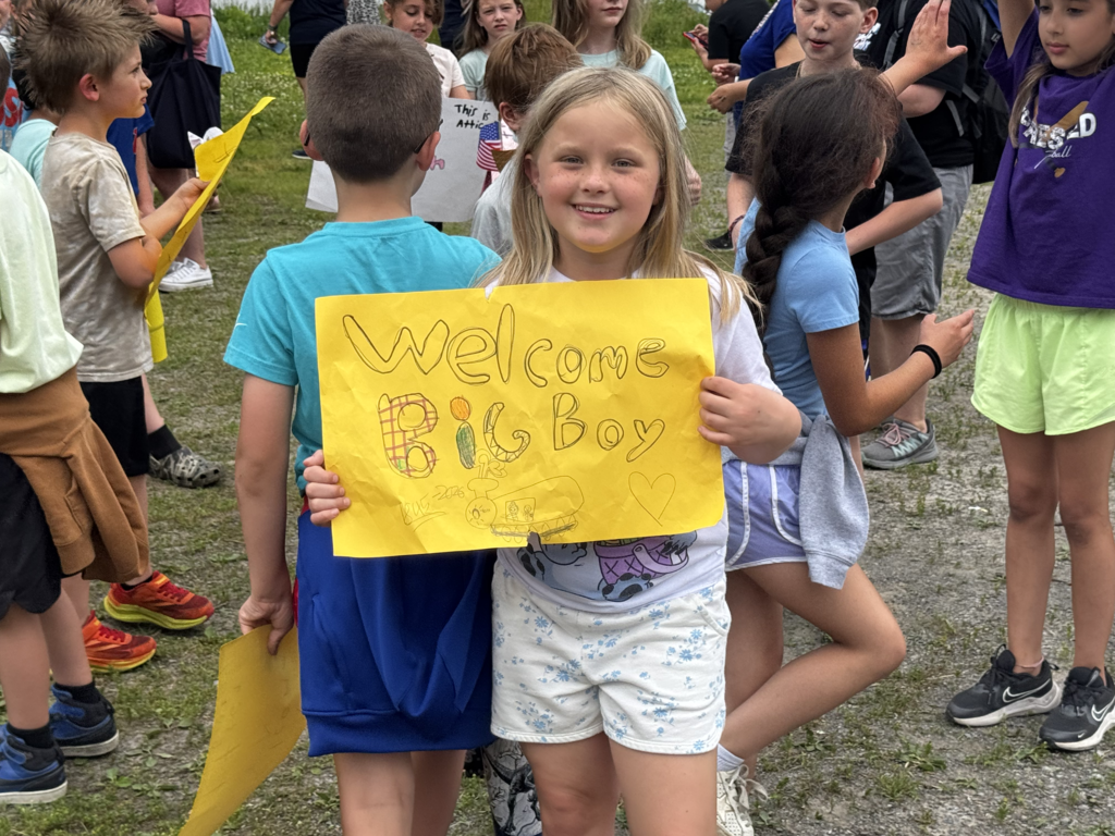 Attica Elementary School students welcome the Union Pacific ‘Big Boy’ 4014 steam locomotive on its swing through Attica Thursday morning.