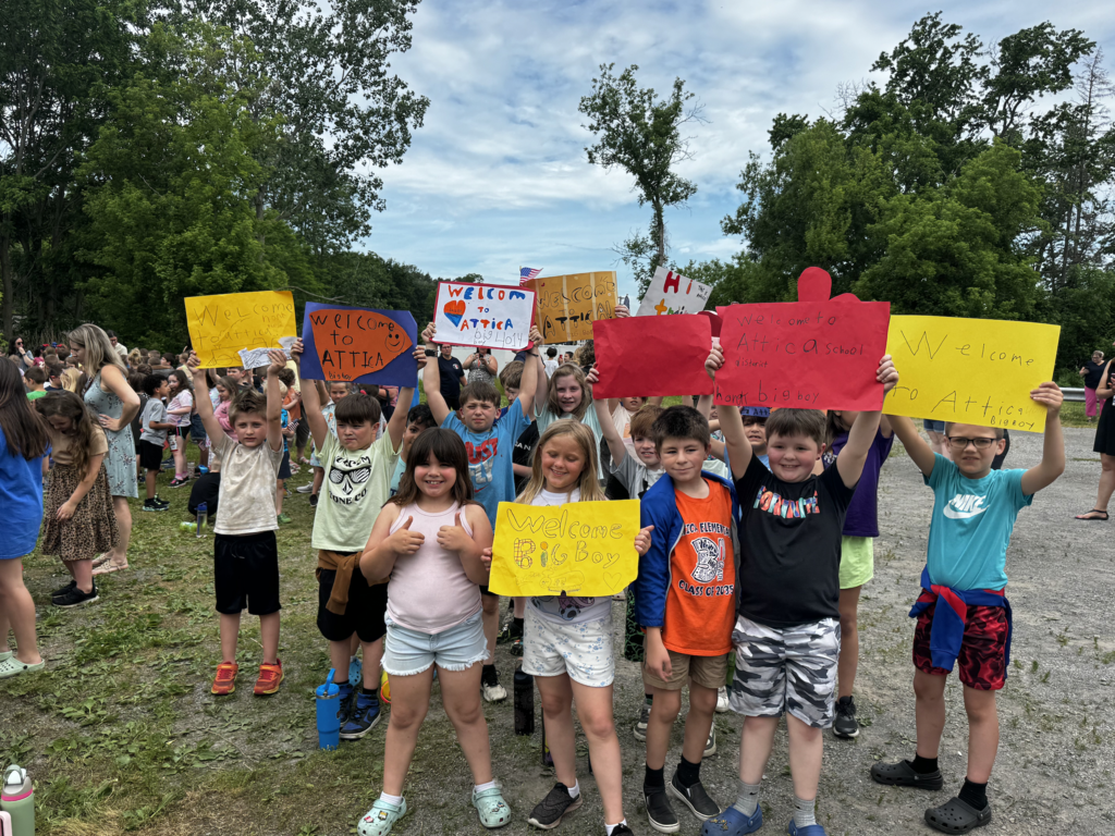 Attica Elementary School students welcome the Union Pacific ‘Big Boy’ 4014 steam locomotive on its swing through Attica Thursday morning.