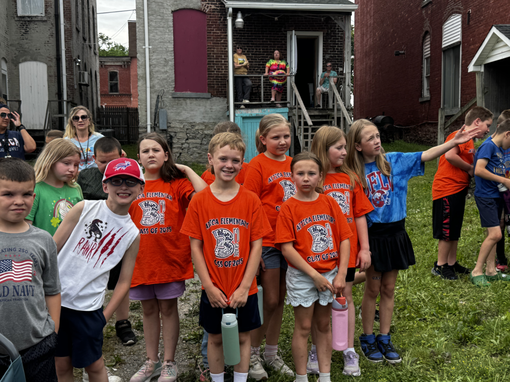 Attica Elementary School students welcome the Union Pacific ‘Big Boy’ 4014 steam locomotive on its swing through Attica Thursday morning.