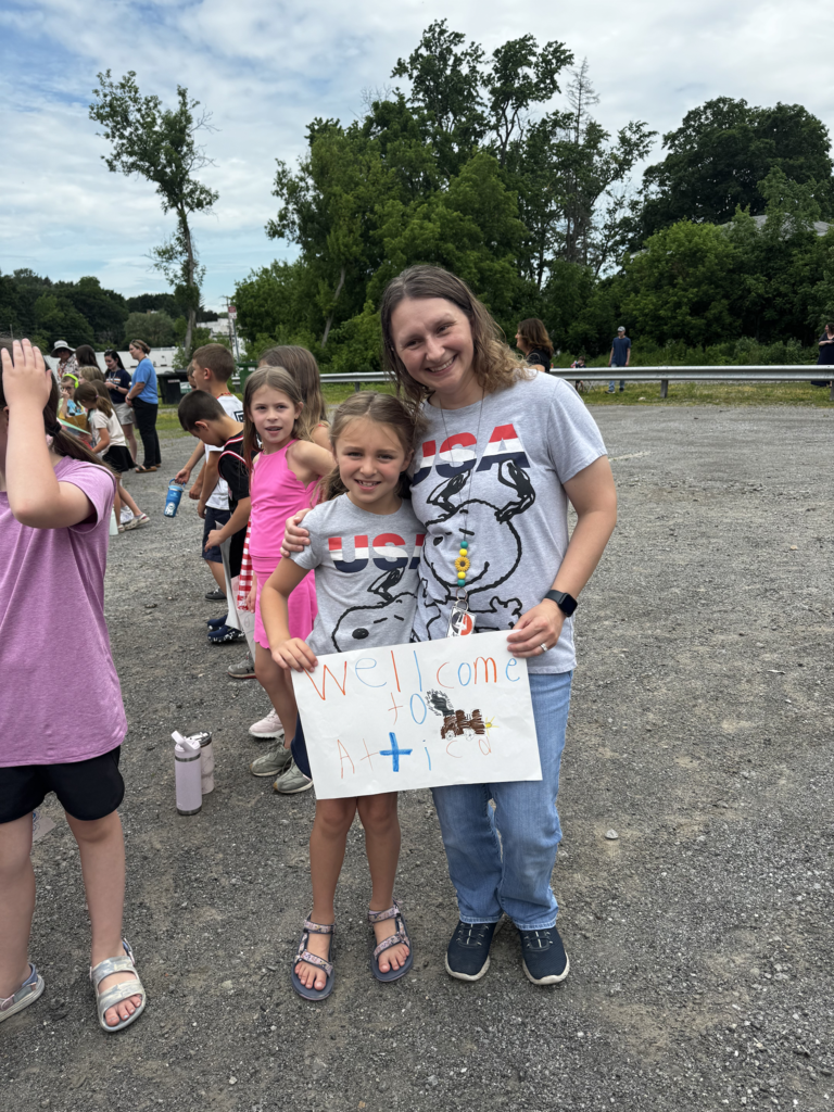 Attica Elementary School students welcome the Union Pacific ‘Big Boy’ 4014 steam locomotive on its swing through Attica Thursday morning.