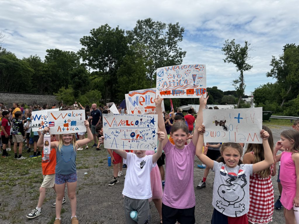 Attica Elementary School students welcome the Union Pacific ‘Big Boy’ 4014 steam locomotive on its swing through Attica Thursday morning.