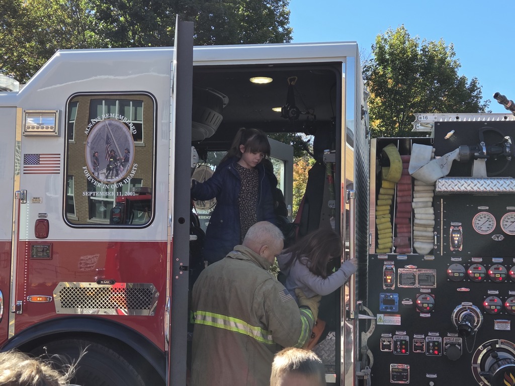 Students walking exiting the firetruck