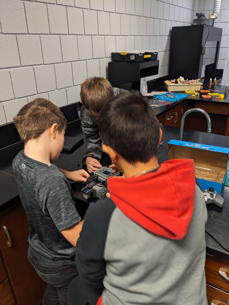 High Ability Students making adjustments to the construction of their robot.