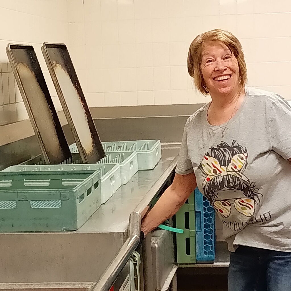 One of our hard-working cafeteria staff in the kitchen.