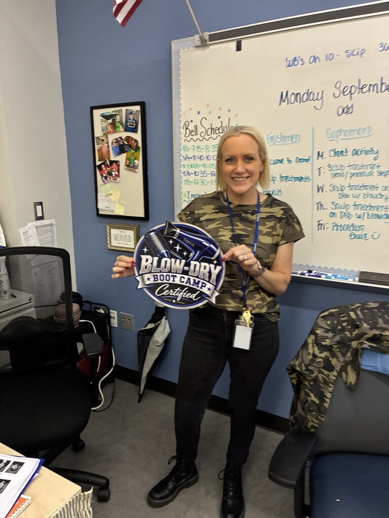Ms. Brodeur holding the sign