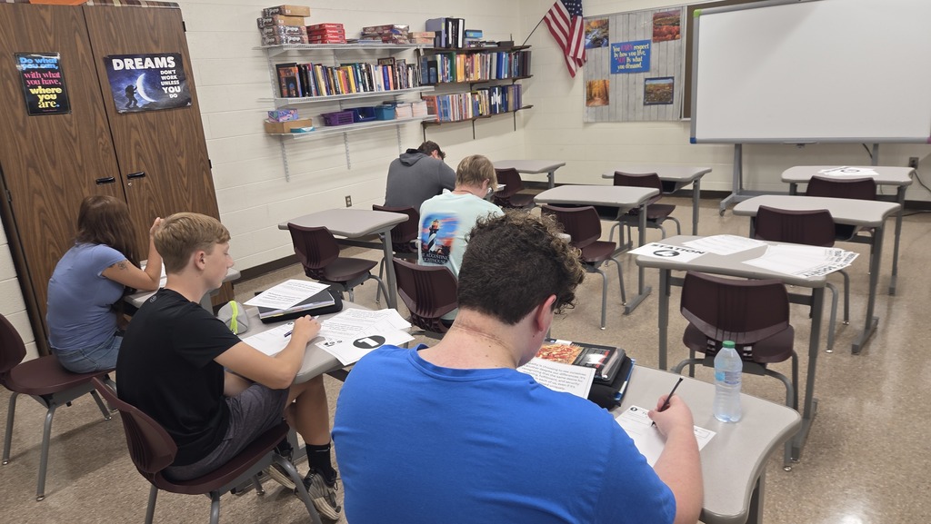 students are working at stations on day one of sociology class.
