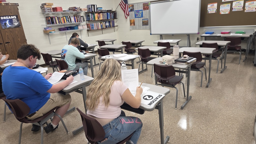 students in sociology are working at 6 stations on day one of the school year.