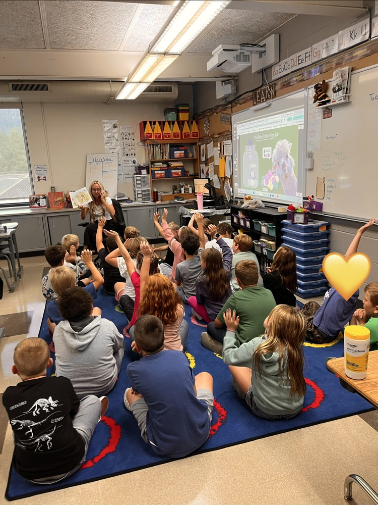 A group of students listening to a story.