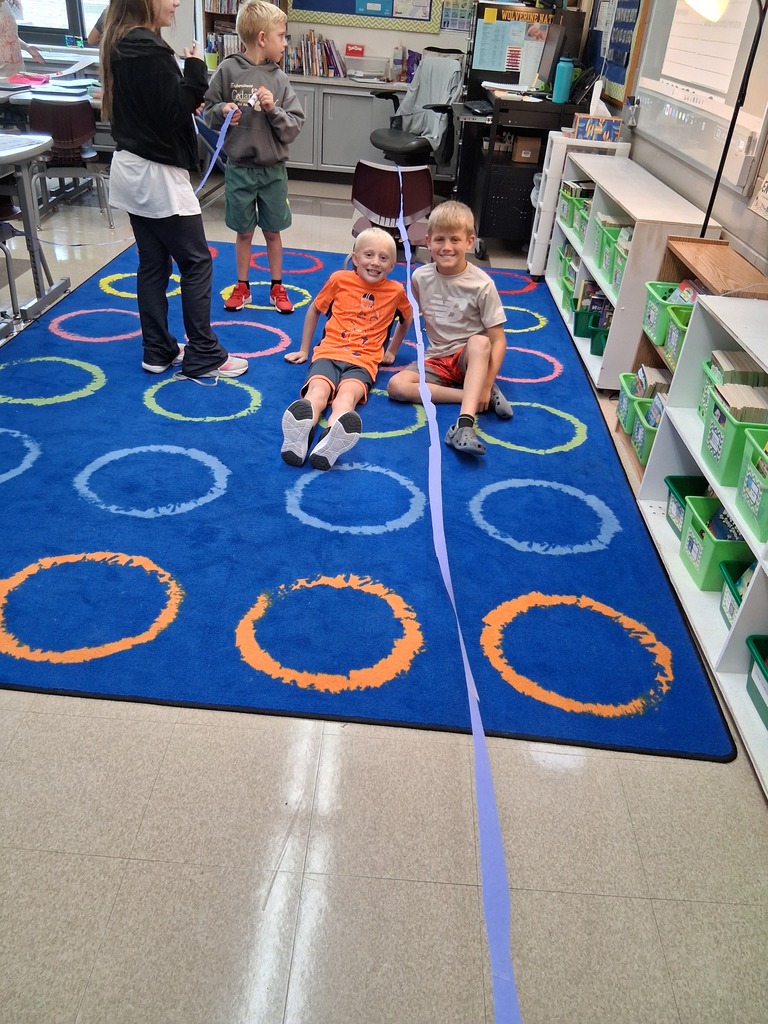 Students posing with the longest built class bridge.