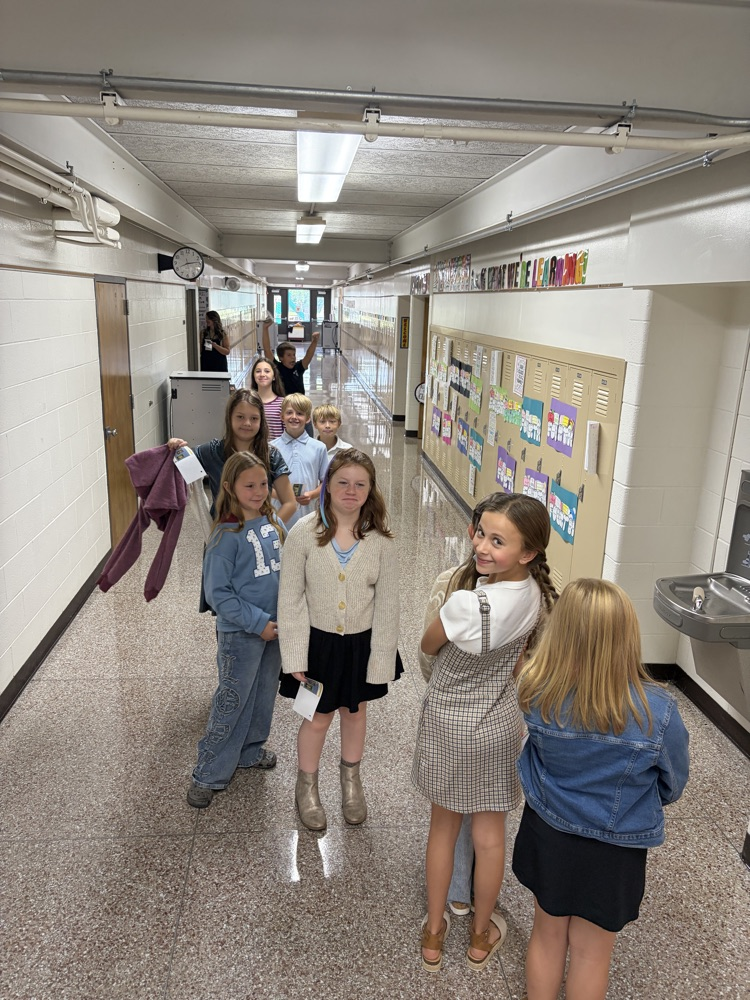 students smiling in line to take their picture