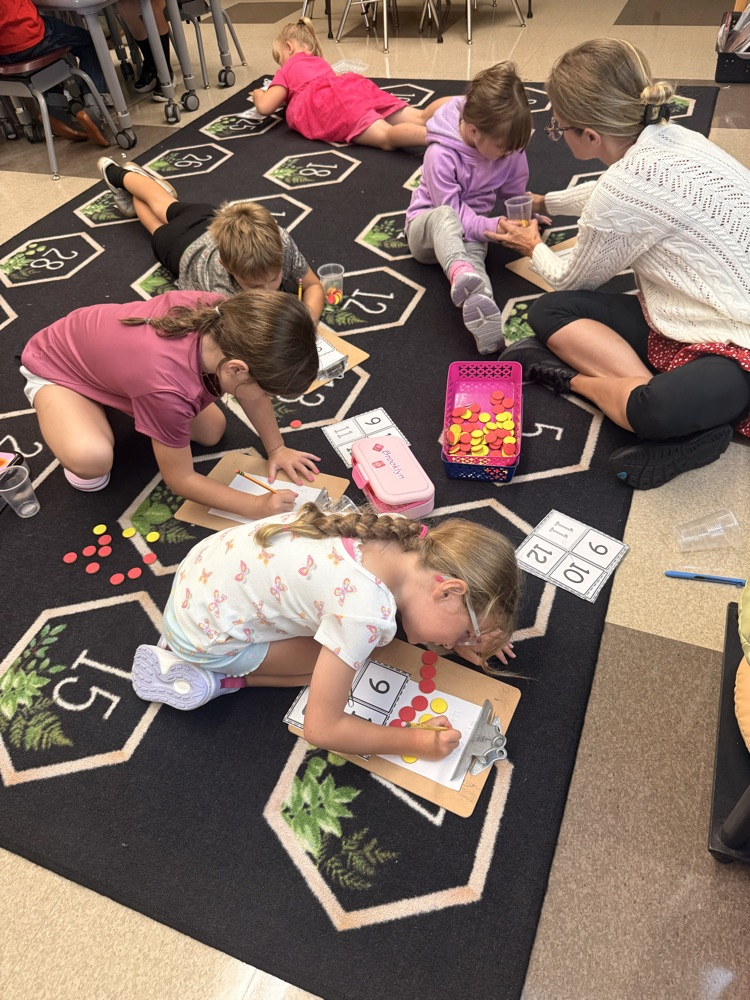students creating addition sentences to match their counters