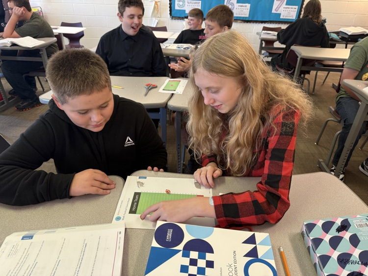 two students rolling dice and playing integer football