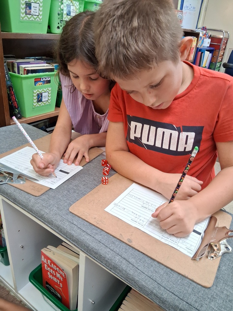 Students playing dice game 