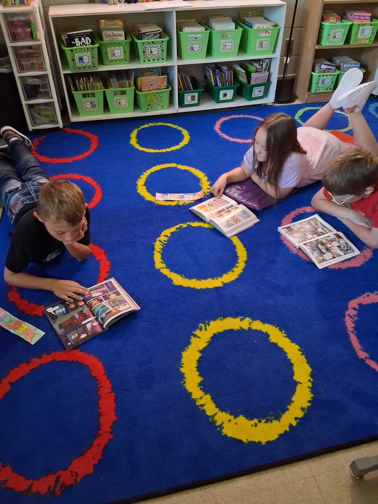 Students read on carpet