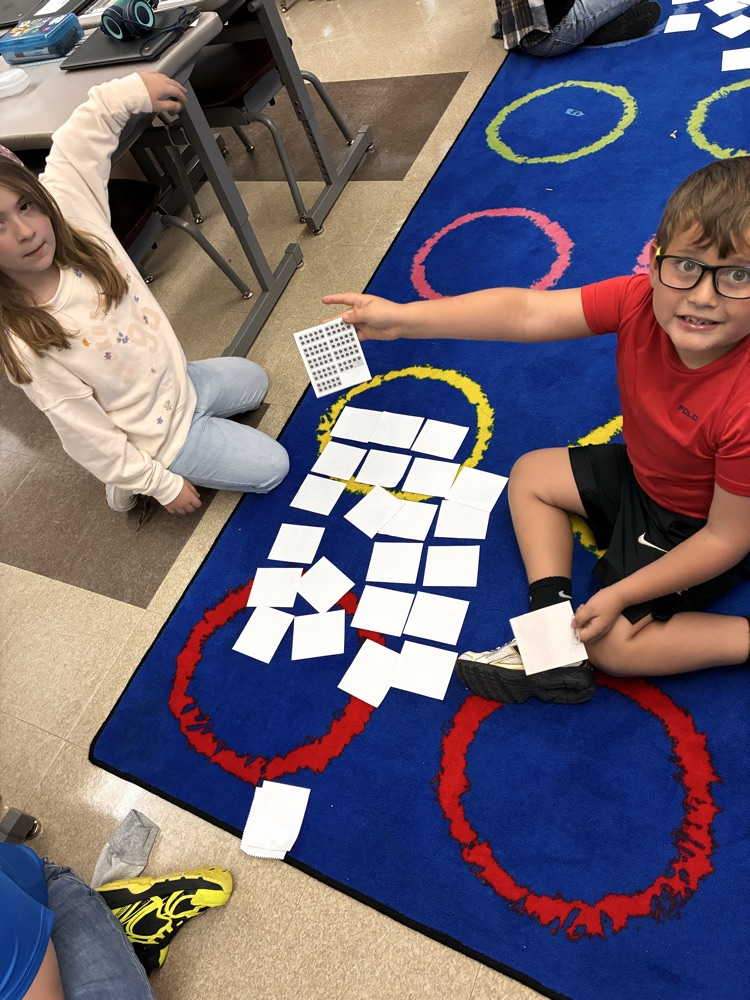 Students playing a learning math game. 