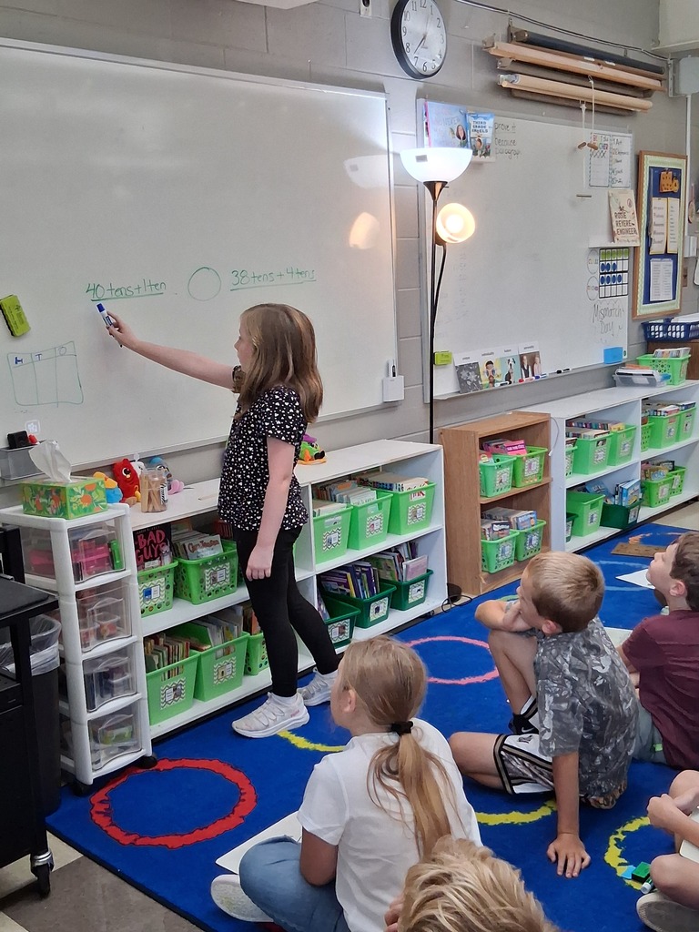 Student teaching the class math