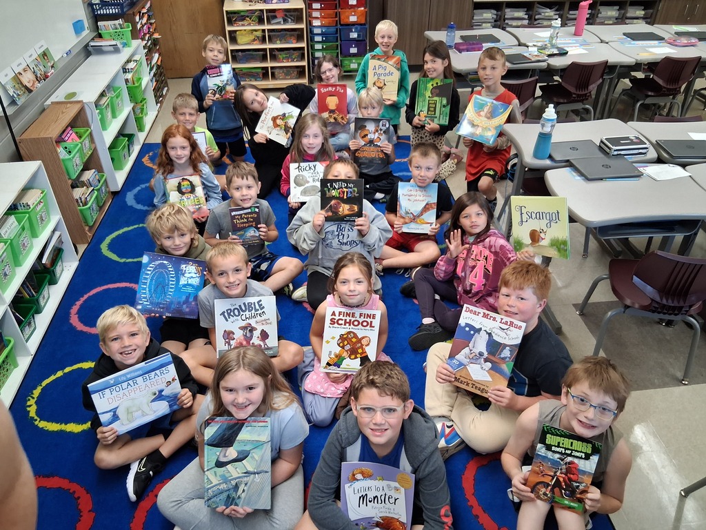 Students posing with books