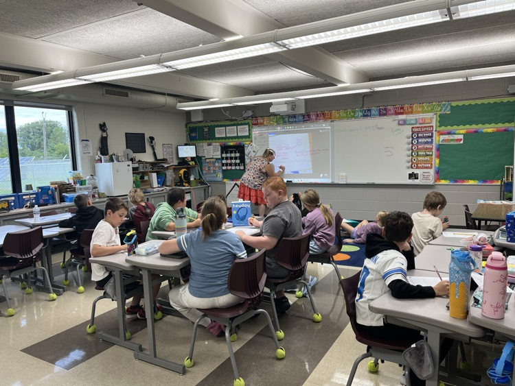 Mrs. Swaid teaching a math lesson with kids participating! 