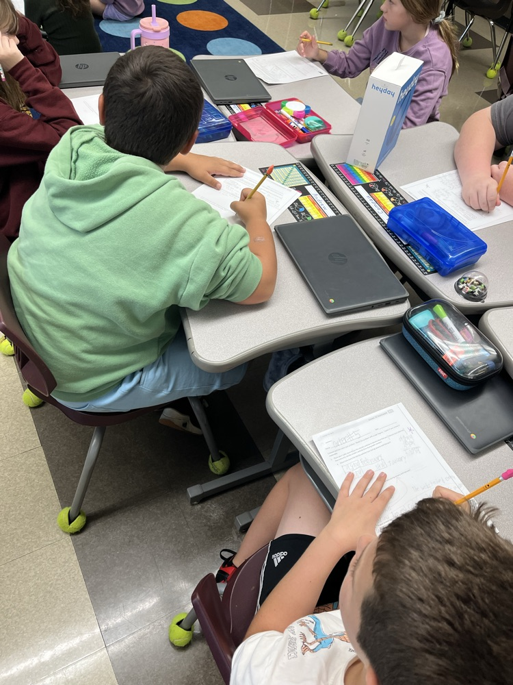 A picture of kids paying attention to the math lesson. 