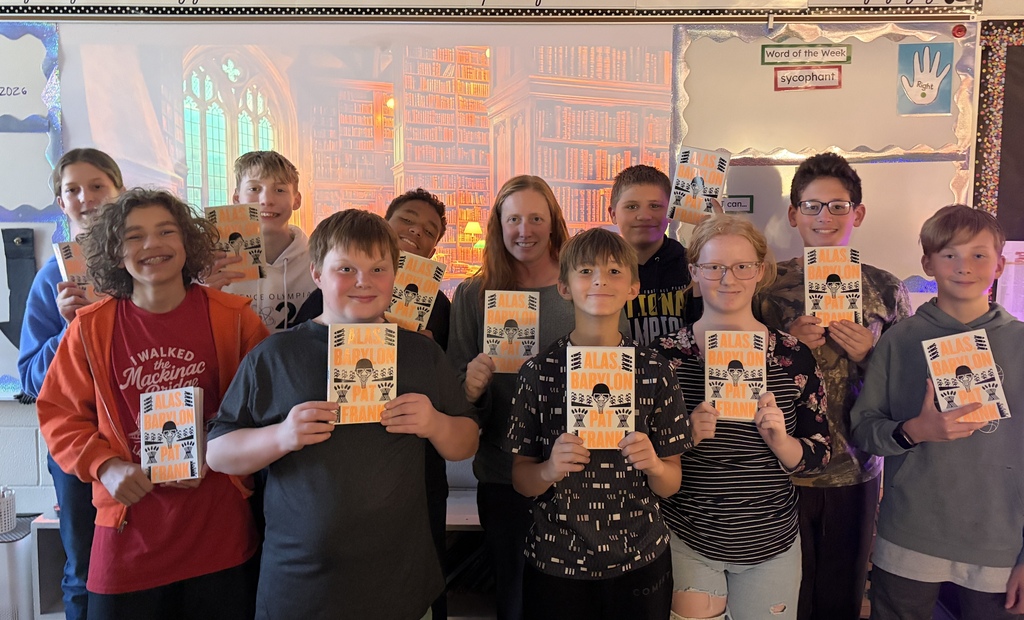 Students holding novels for a book club
