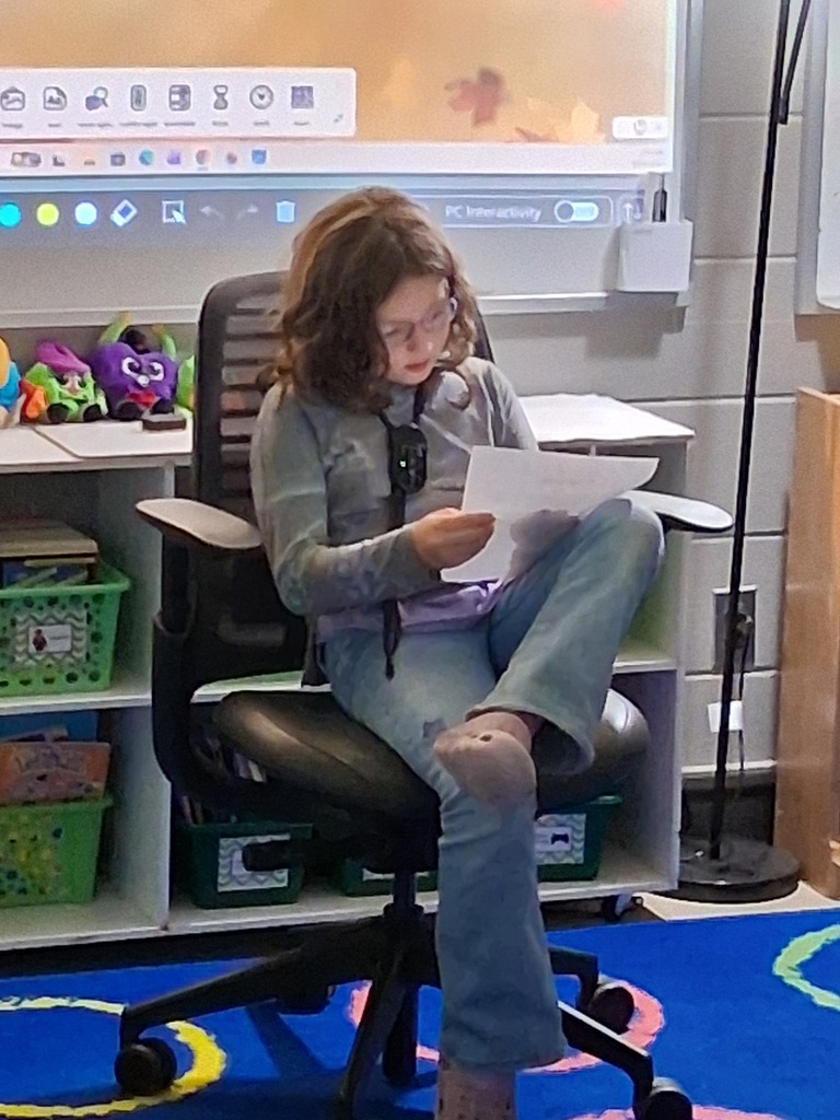 Student reading their writing