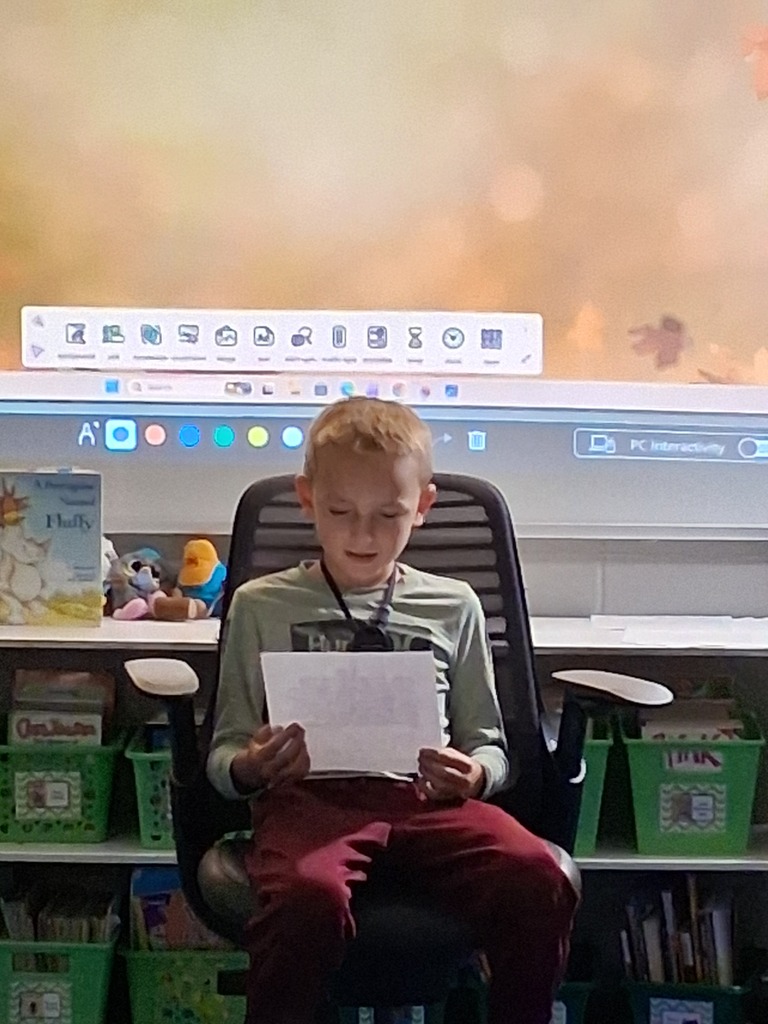Student reading their writing