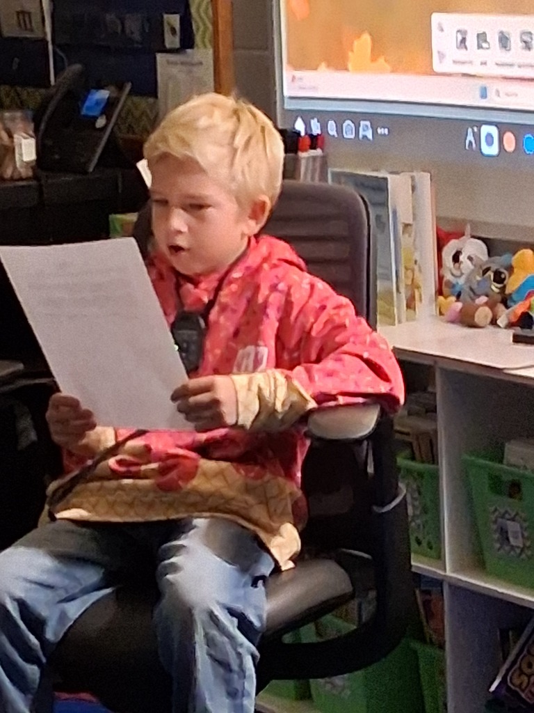 Student reading their writing