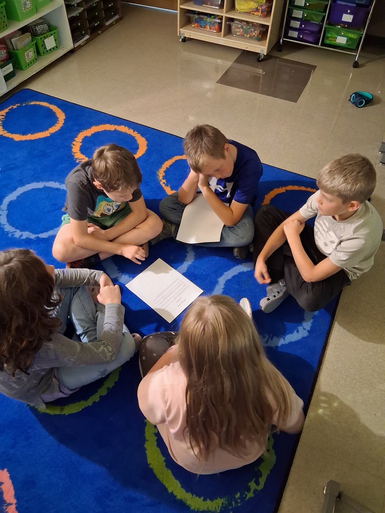 Students reading writing as a group