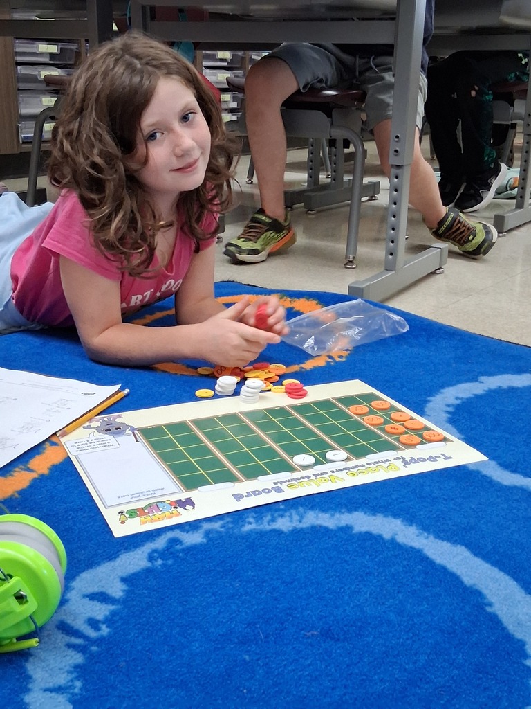 Student using place value disks