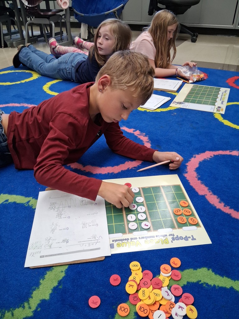 Student using place value disks