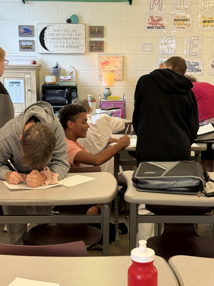 students surrounded a problem they found under a desk