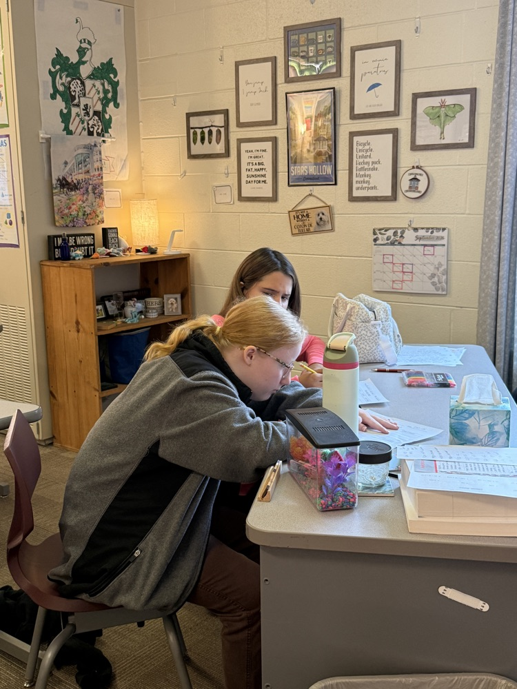two students completing a problem at Ms. Rinn’s desk