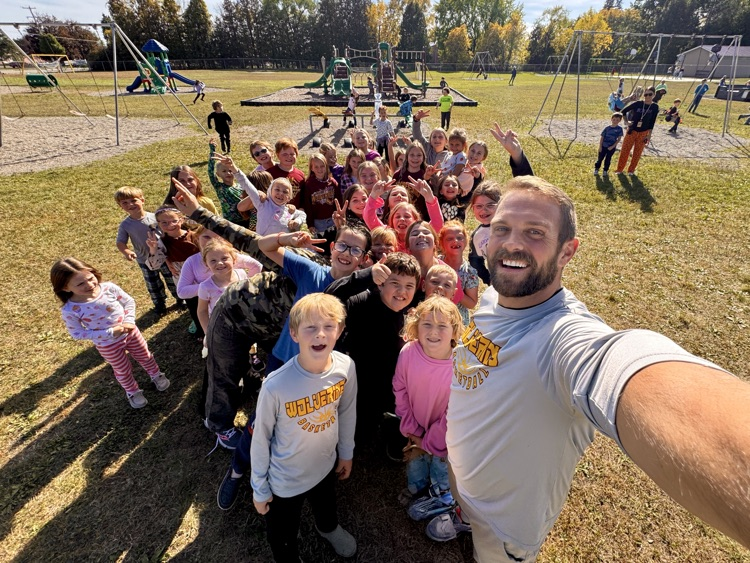 bunch of kids out at recess with Mr. Blackmore