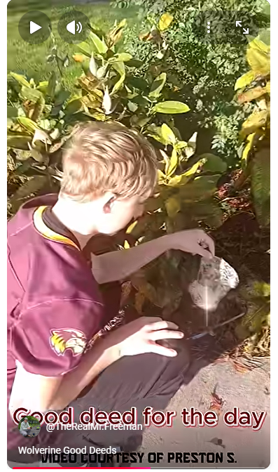 student picking up trash