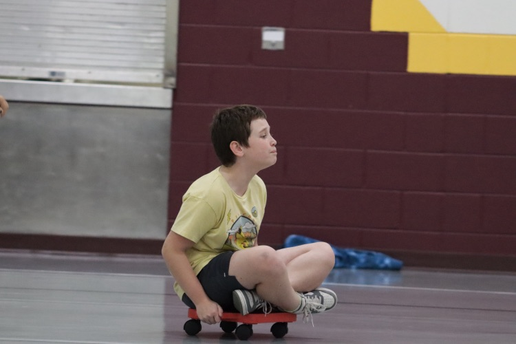 boy riding a scooter
