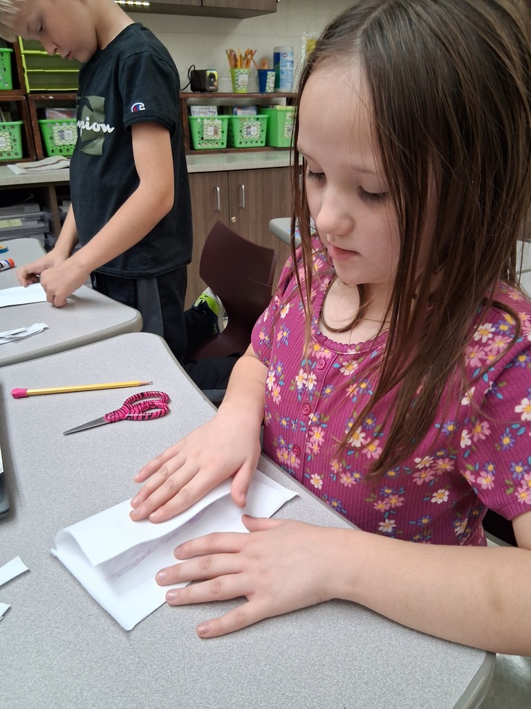 Students making envelopes