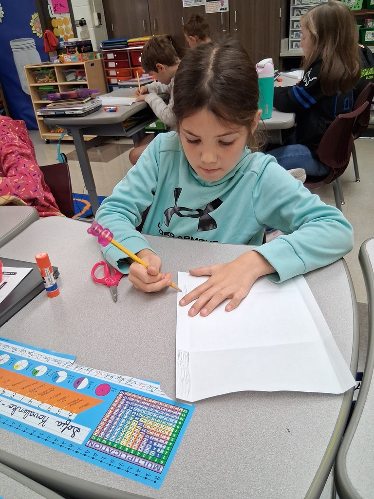 Students making envelopes