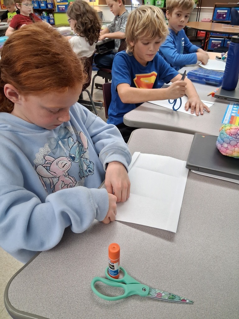 Students making envelopes 